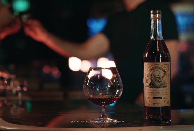 Smith Devereux Brandy Product A bottle of Smith Devereux spirits with a vintage-style label next to a snifter glass filled with amber liquid