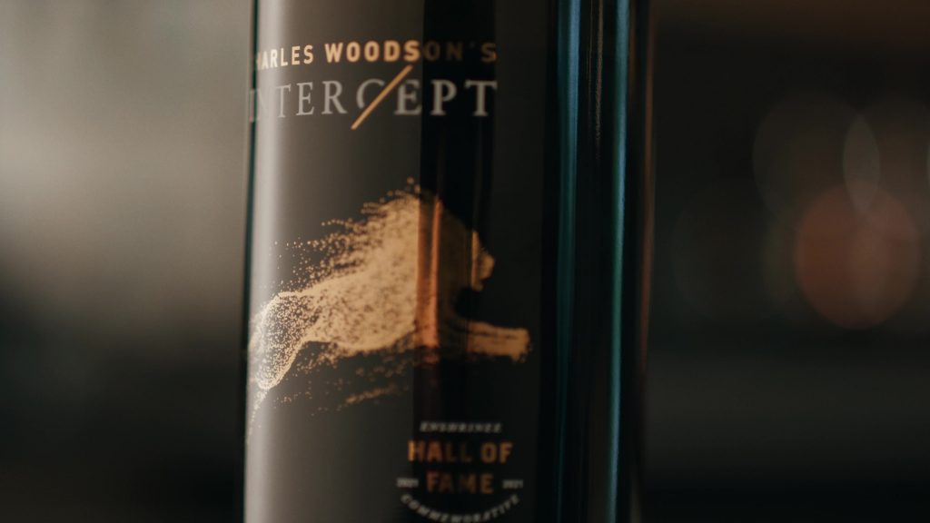 Close-up view of a Charles Woodson's Intercept Wine bottle.